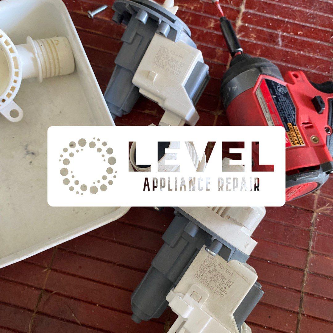 Washing machine parts and tools, a drain tray, and a drill, on a tiled floor. Level Appliance Repair logo.