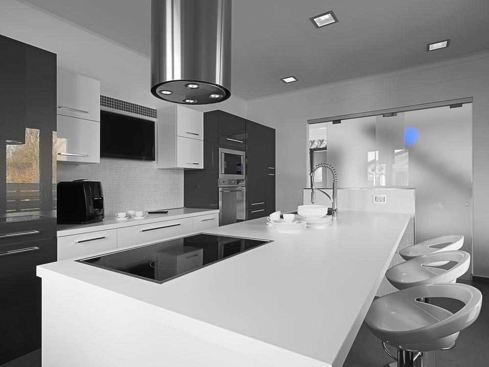 A Kitchen with A Large Island and A Stove Top Oven — Smith's Joinery in Bangalow, NSW