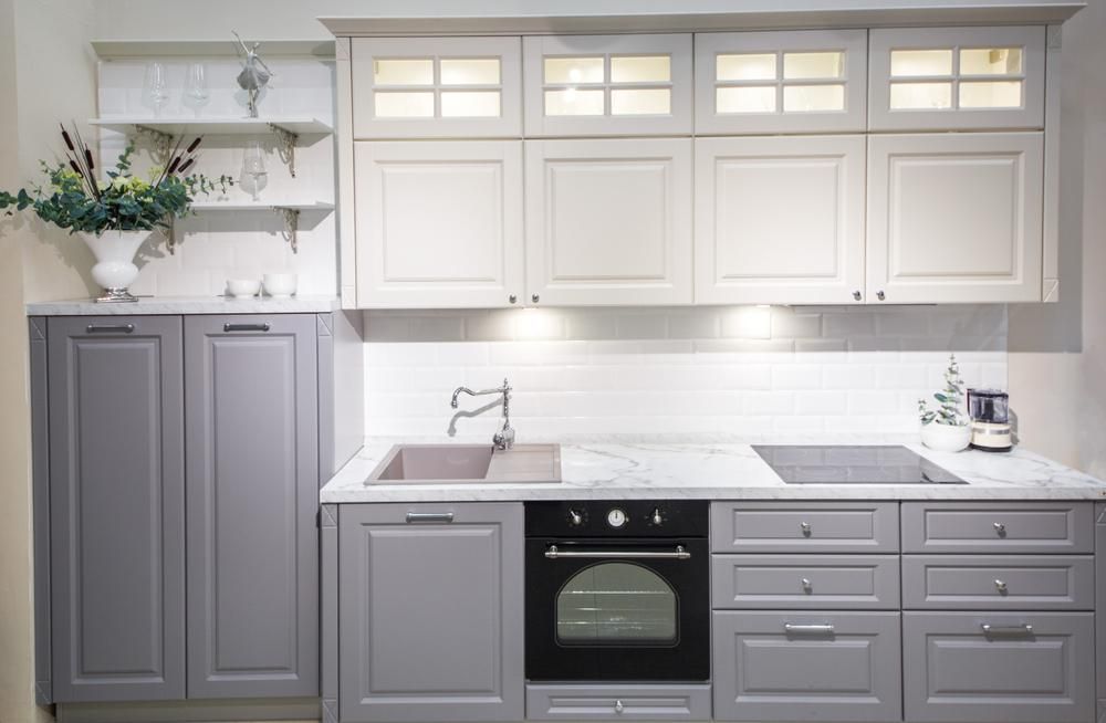A Kitchen with Gray Cabinet, White Counter Tops, a Sink, and An Oven — Smith's Joinery in Evans Head, NSW