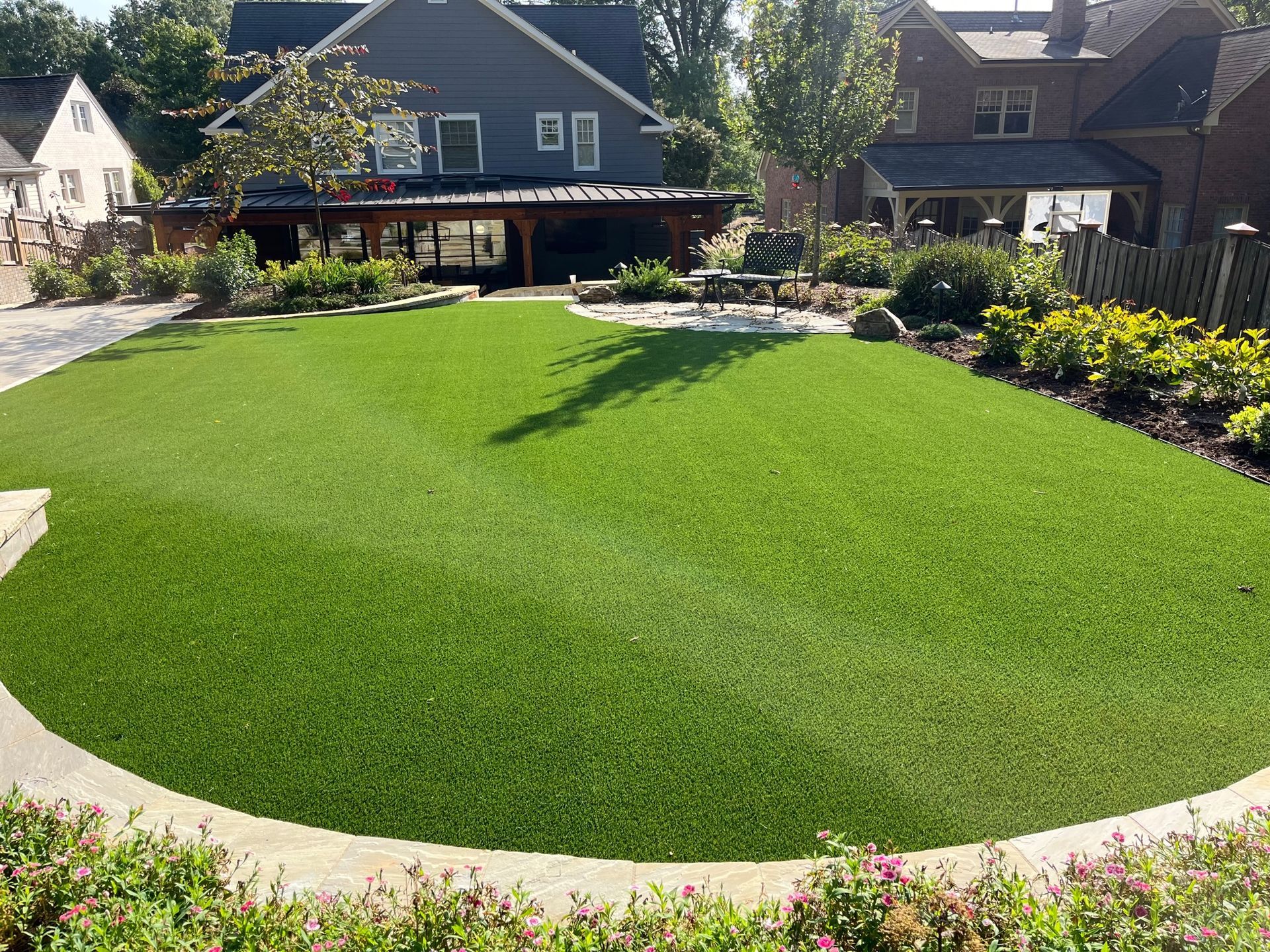 A house with a large lawn in front of it