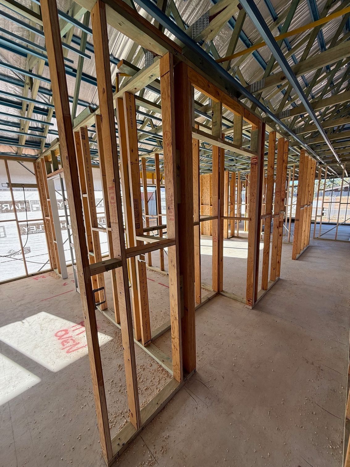 A building under construction with a lot of wooden frames