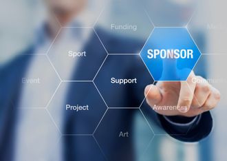 A man is pressing a button on a screen that says sponsor.