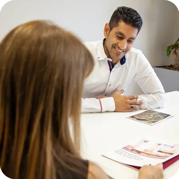 Reza Hooda discussing accounting services with a client