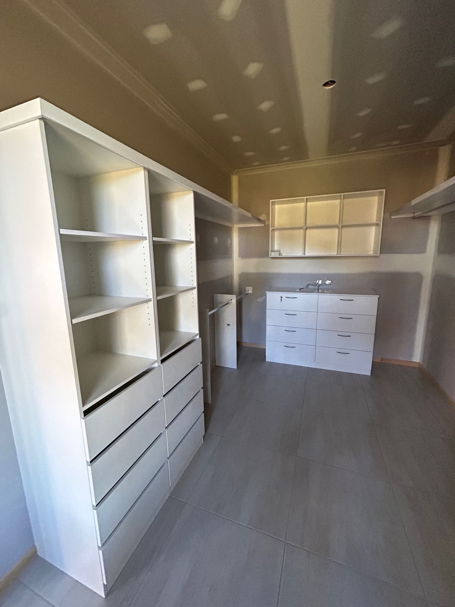 A Walk in Closet with Lots of Shelves and Drawers — Formosa Building And Renovations in Childers, QLD