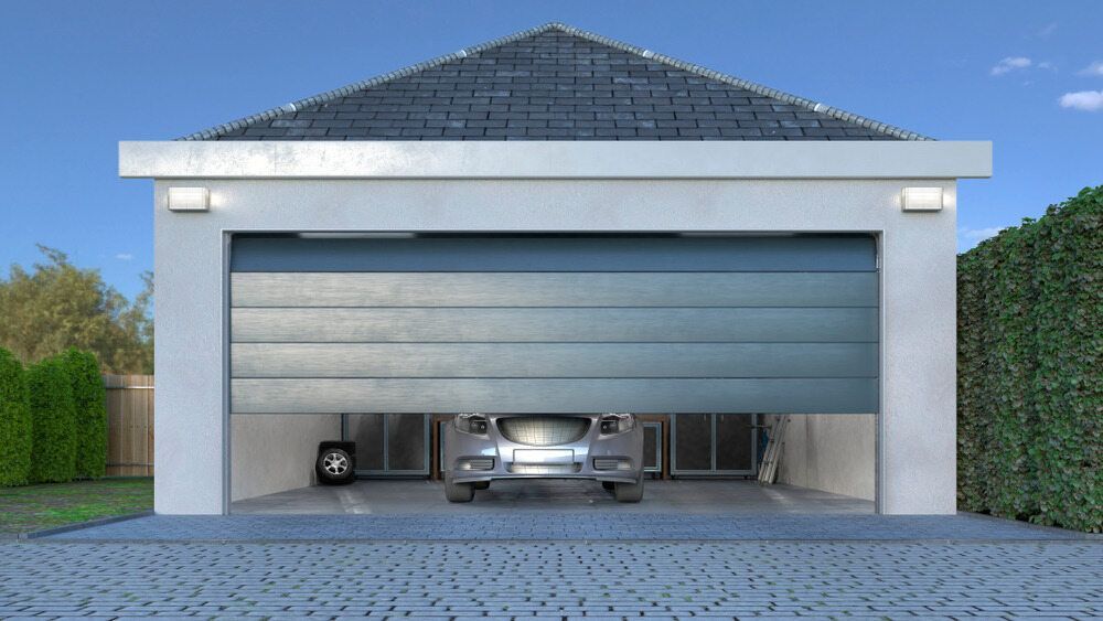 Garage With a Car Inside and the Door Partially Open — Duncan's Doors In Crows Nest, QLD