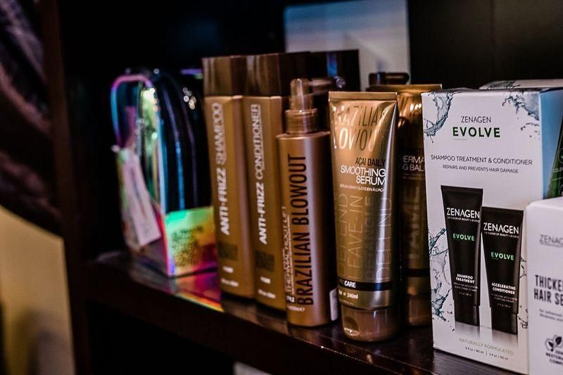 Hair care and skincare product tubes and boxes displayed on a shelf