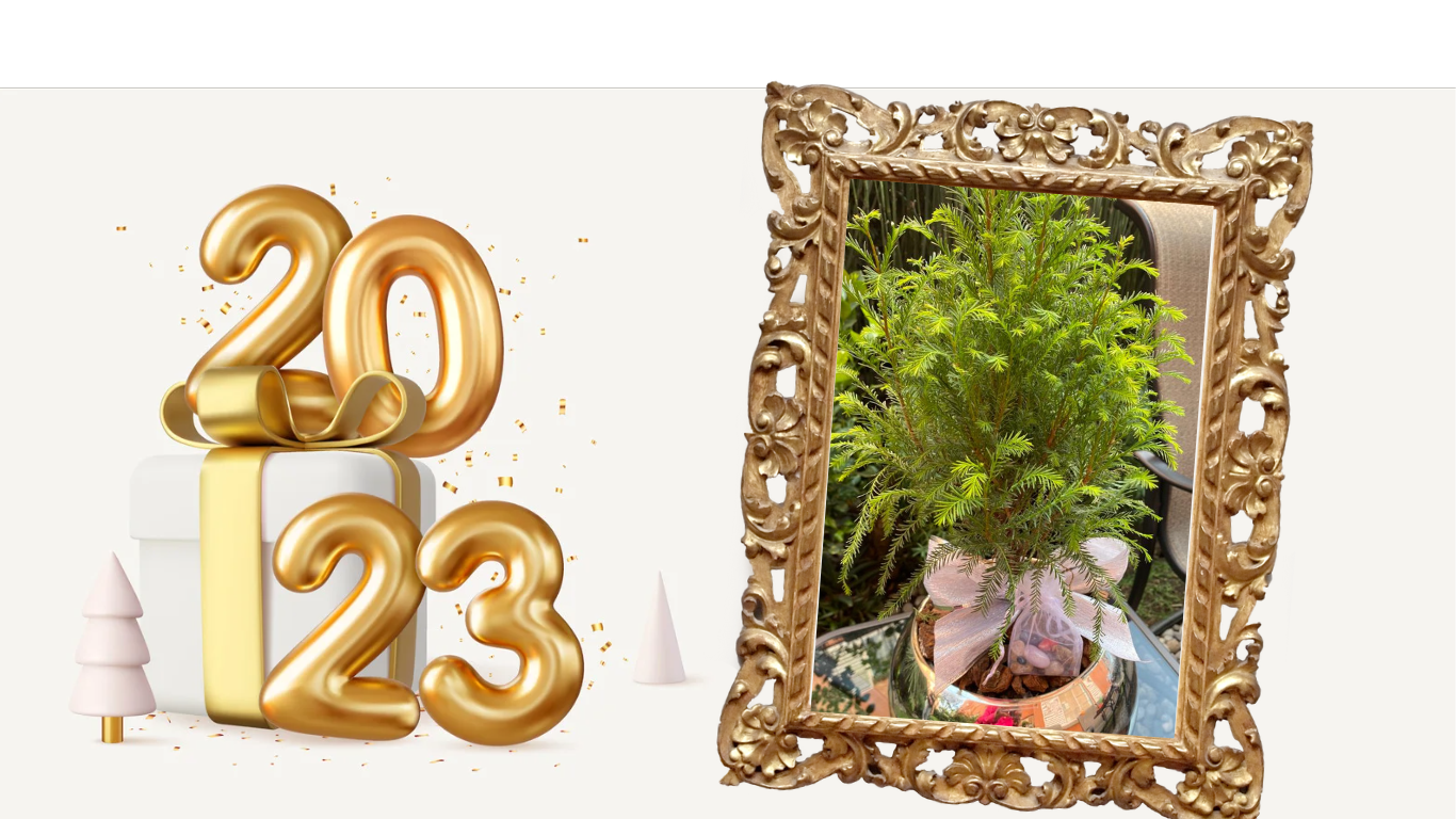 Oro 2023 con regalo y árbol en un marco dorado adornado, sobre fondo blanco.