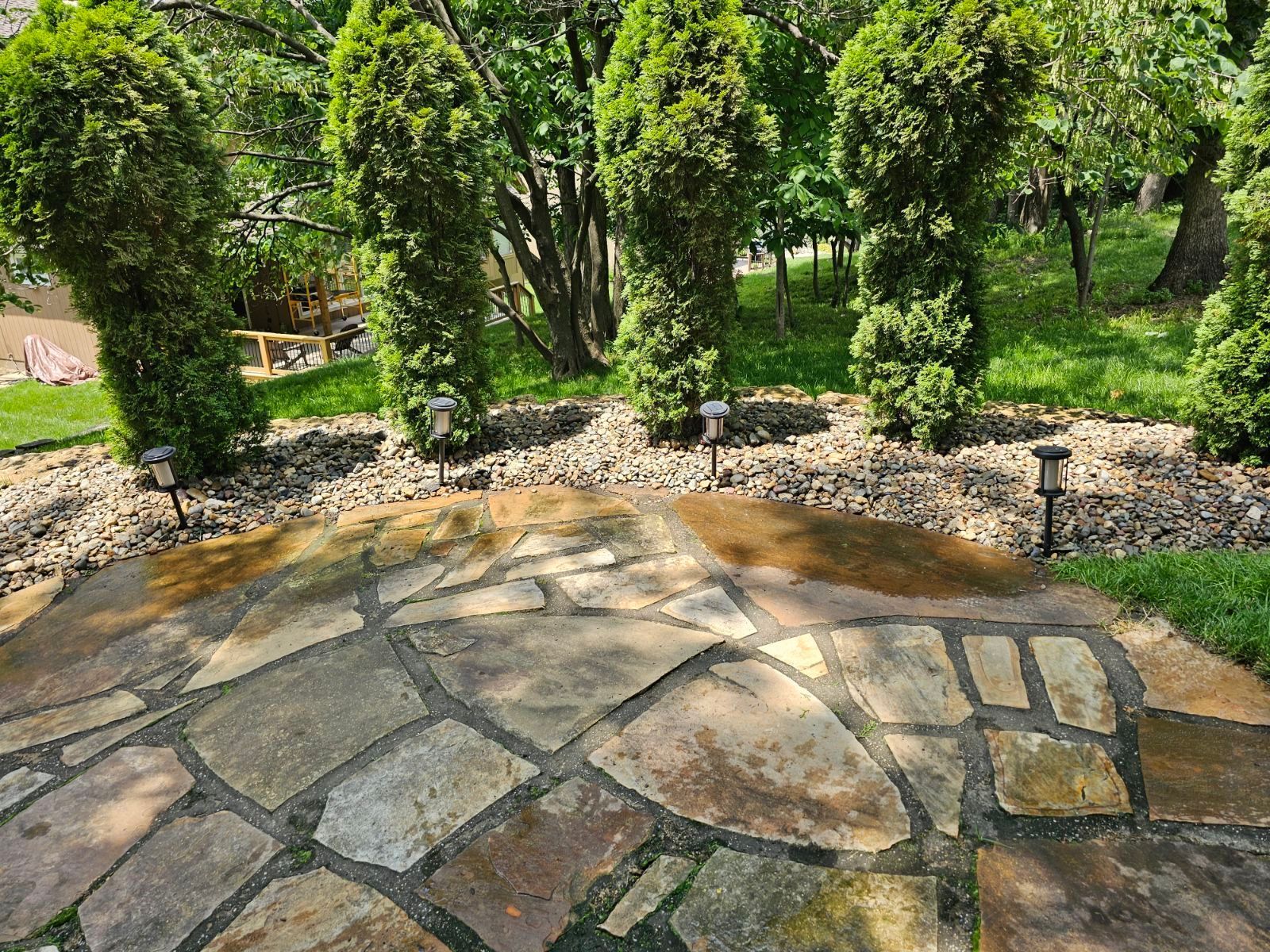 Yard showing balanced combination of mulch, rocks, and well-kept grass