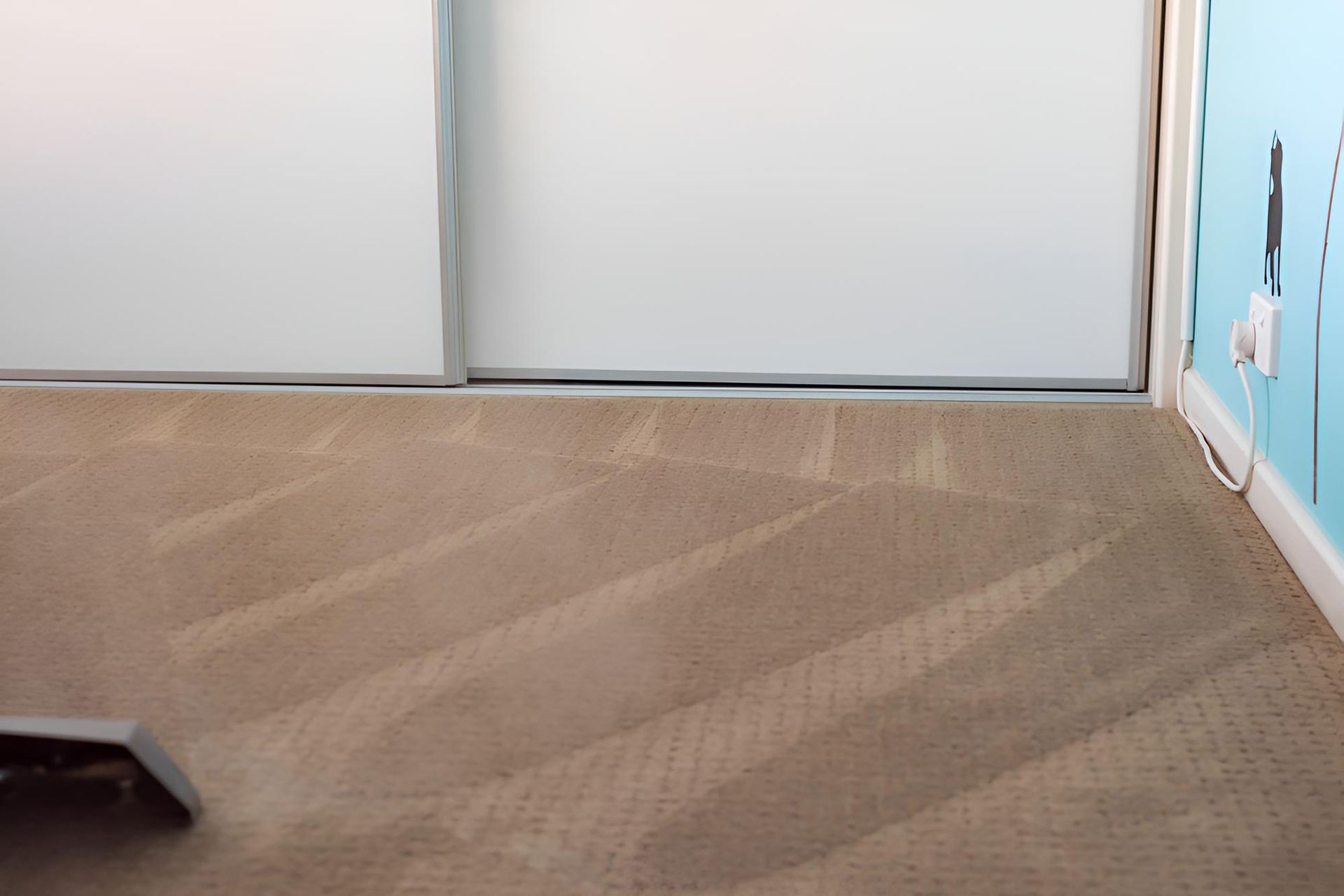 Room With a Carpeted Floor and a White Door — Affordable Carpets & Mats in Caboolture, QLD