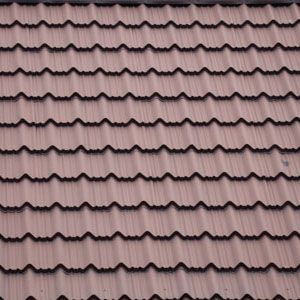 Close-up of a brown, corrugated metal roof with a repetitive, wavy pattern.