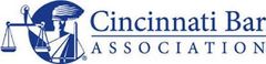 The cincinnati bar association logo is blue and white