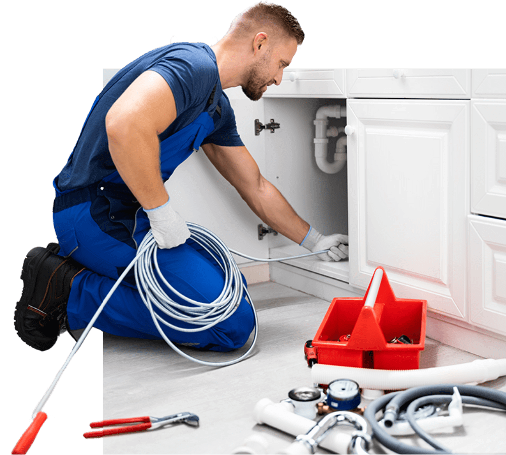 plumber fixing sink in home