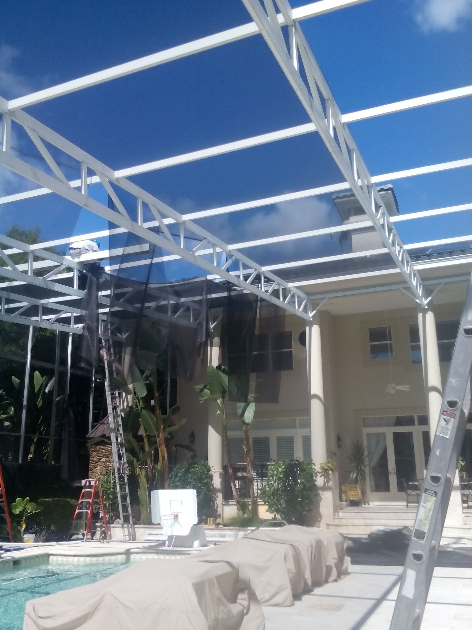 Large House Installing Enclosure - DeLand, FL - Phelps Aluminum & Supply LLC