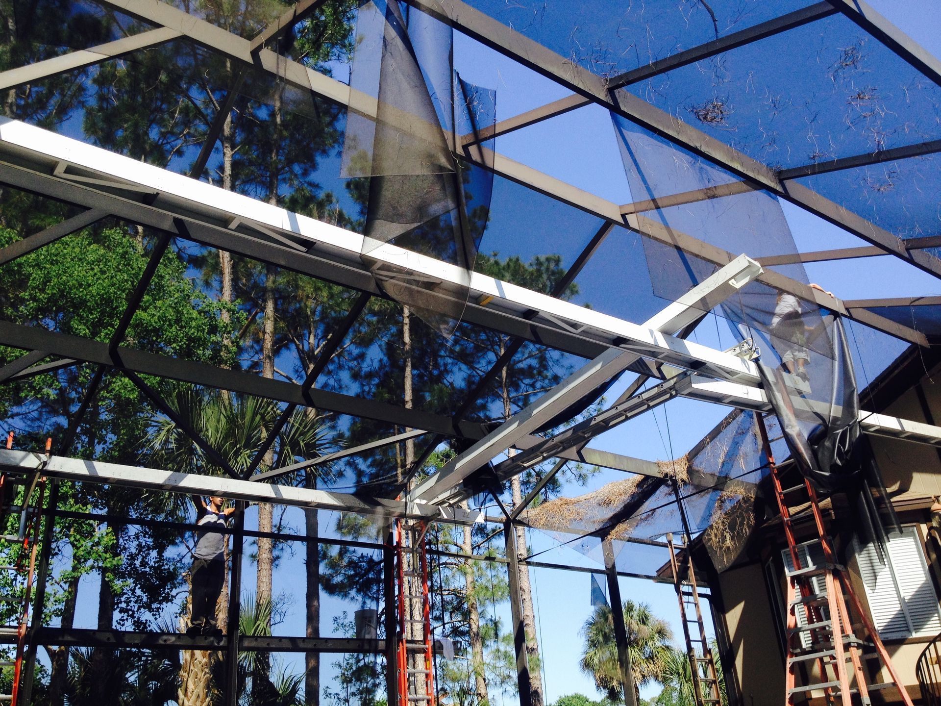 Installing Enclosure In A Pool - DeLand, FL - Phelps Aluminum & Supply LLC