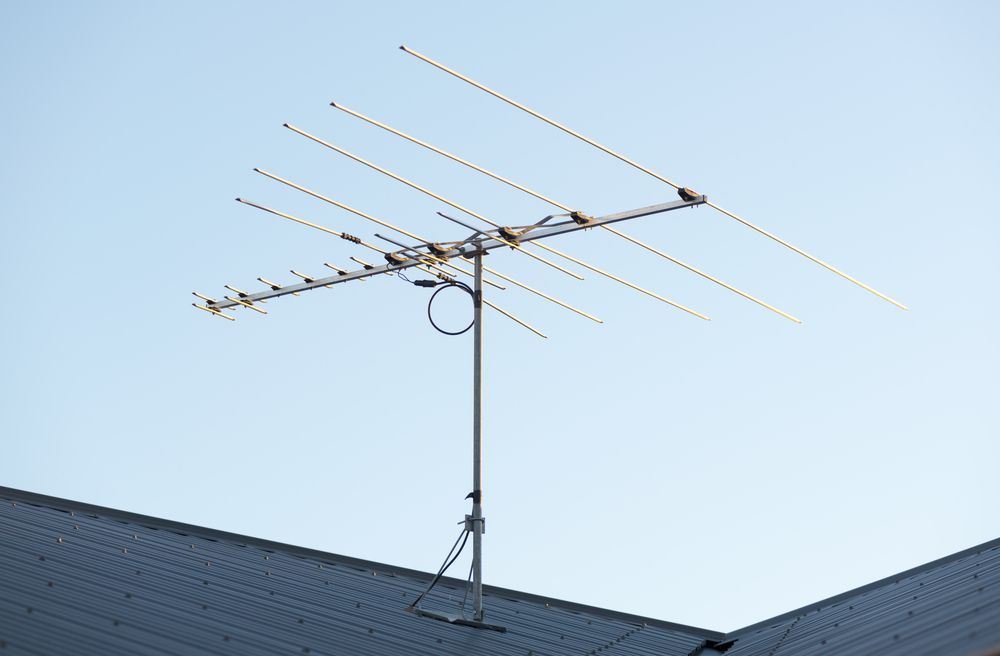 A Large Antenna Is Sitting On Top Of A Roof — Craig's TV/Antenna Services In Newcastle, NSW