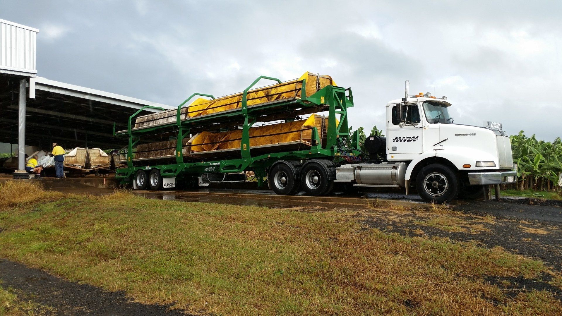 A White Semi-Truck Hauling Large Machinery — Aust. Advanced Trailer Sales & Service in Berrimah, NT