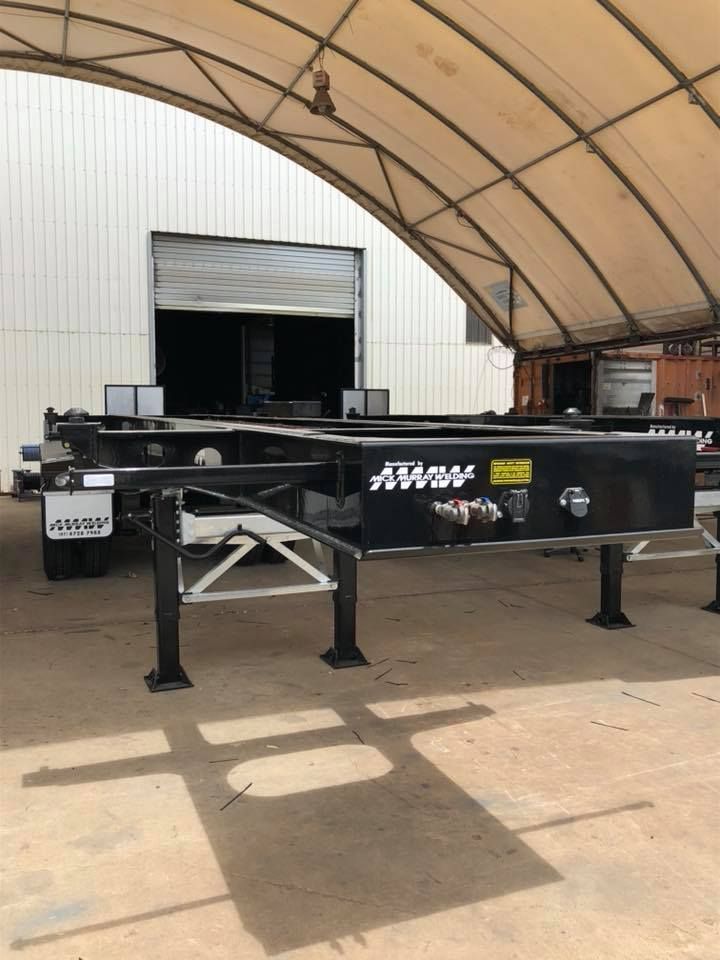 A Black Trailer Chassis Under a White Arched Roof — Aust. Advanced Trailer Sales & Service in Berrimah, NT