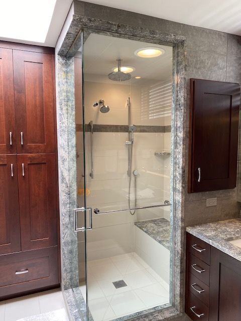 Owners-+Bathroom+shower+with+linen+cabinet+and+partial+sink+counter.jpg