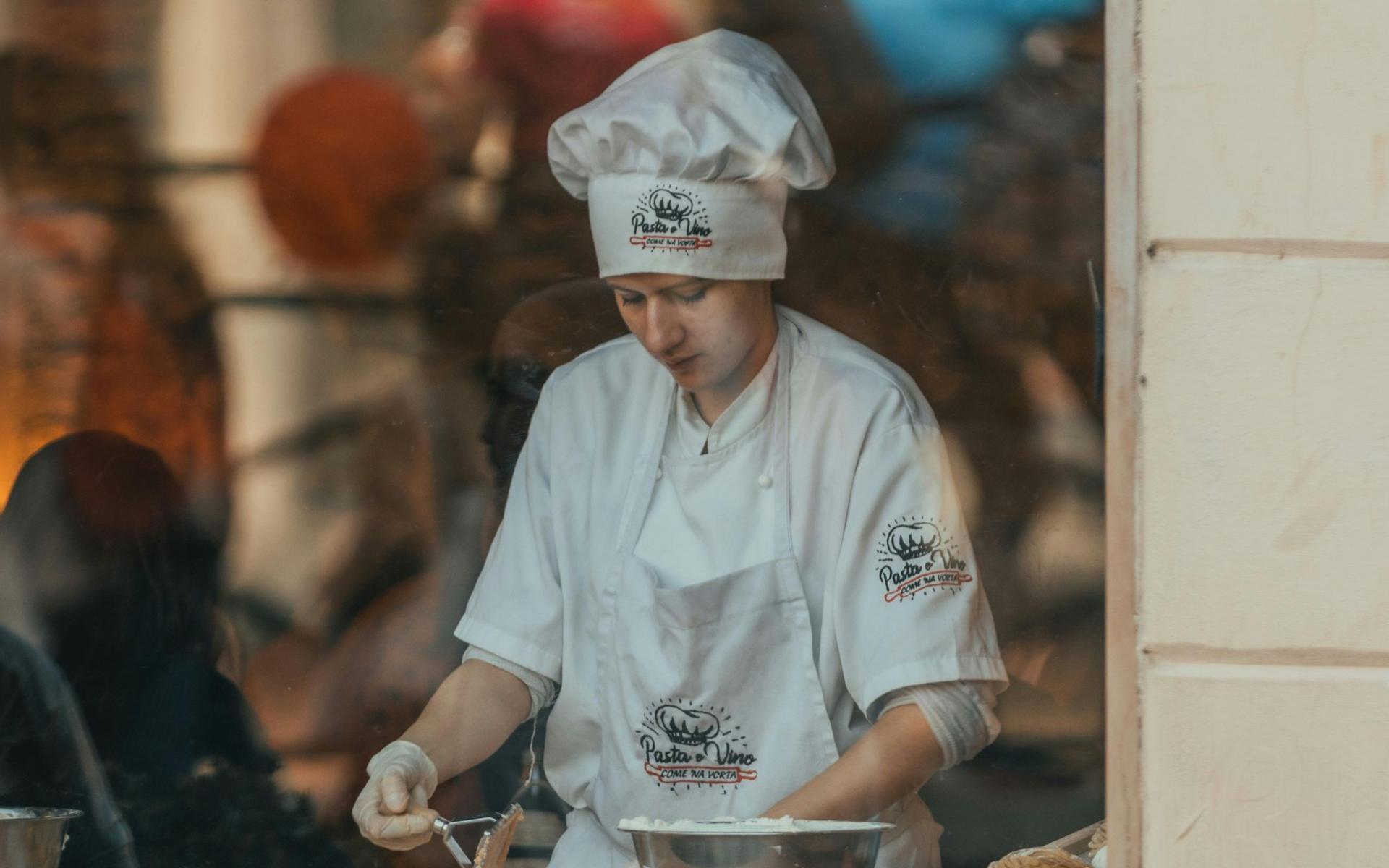 chef cooking in window