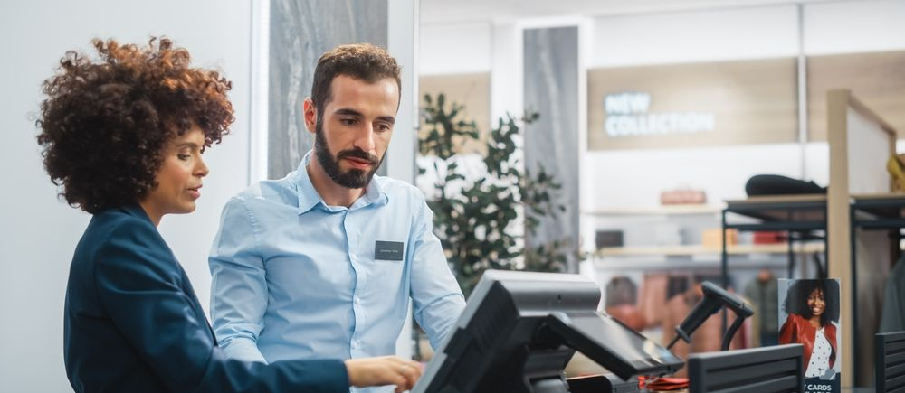 two people working at the front desk in hospitality two people working at the front desk in hospitality