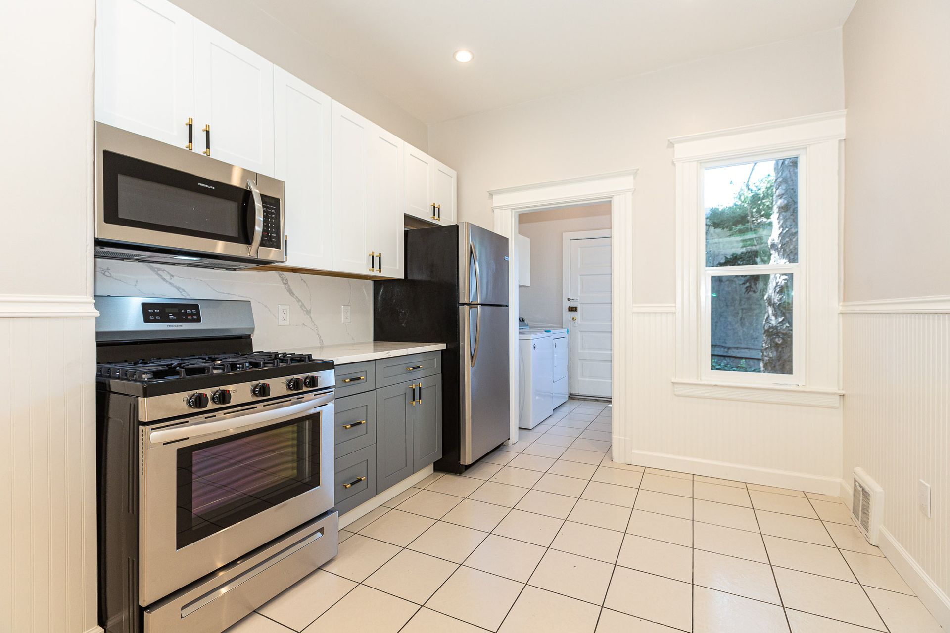 Kitchen with stove and refrigerator