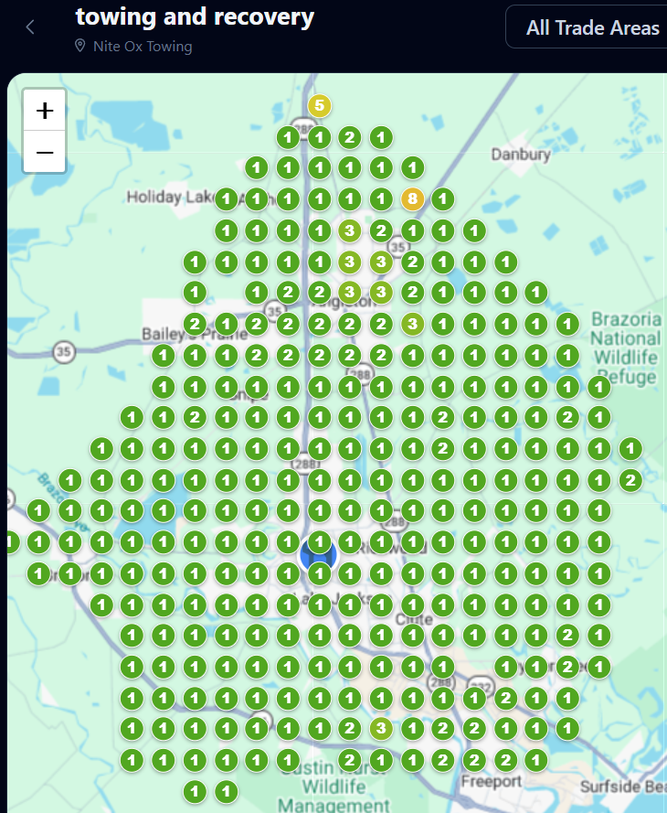 Map of towing and recovery service locations marked by many green pins in a coastal area.