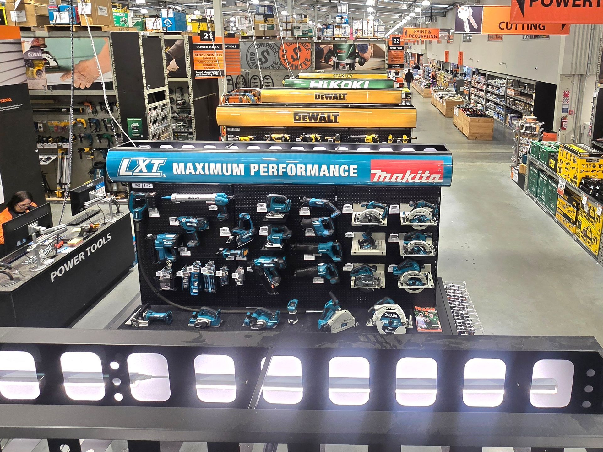LED batten lights illuminating the back of the signs and tools at Mitre 10 Ferrymead.