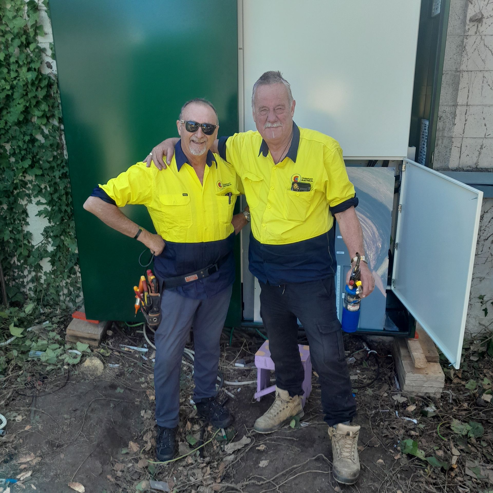 Bruce Davison and Gavin Bowden of Christchurch Electrical in front of switchboard replacement.