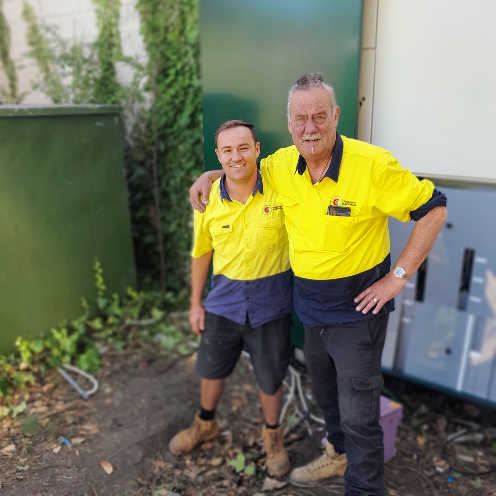 Bruce Davison and Adam Gyde of Christchurch Electrical in front of switchboard replacement.