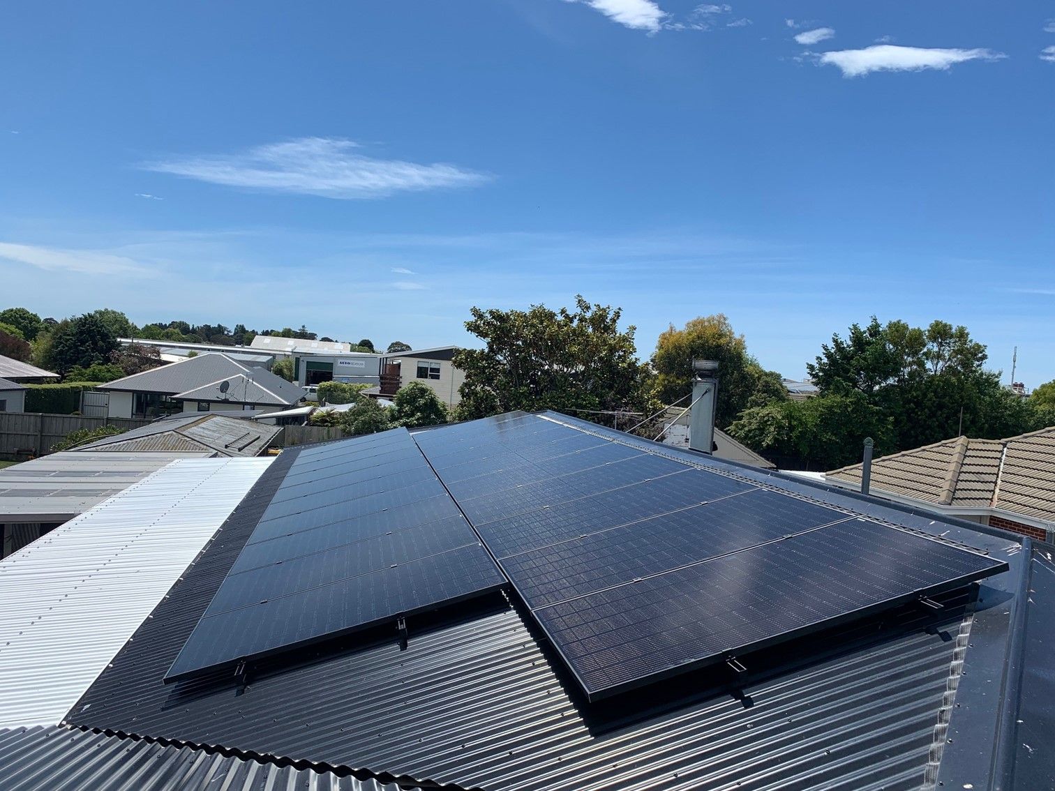 Black solar panels on residential roof in Christchurch, NZ.