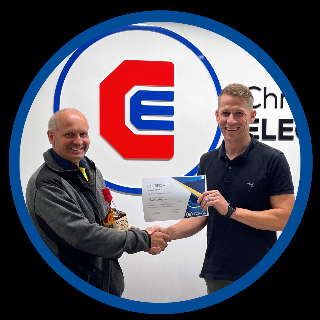 Nick Wilson, Chch Elec staff member receiving a 15 year anniversary gift