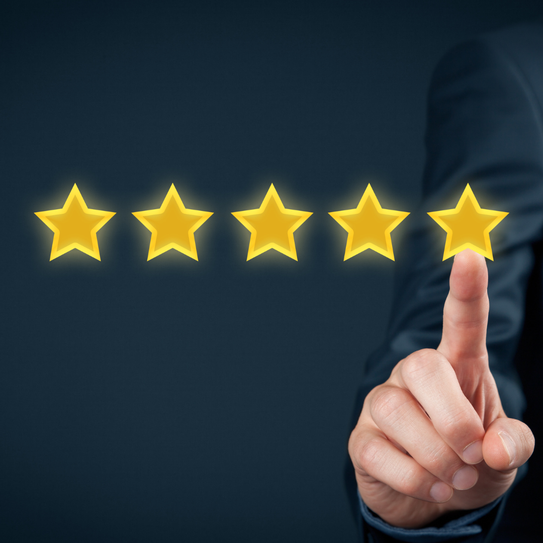 5 gold stars, with man's finger touching a star