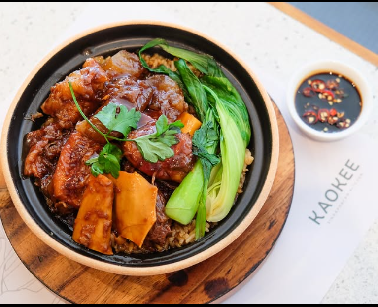 Braised pork rice bowl with bok choy and dipping sauce at Kaokee