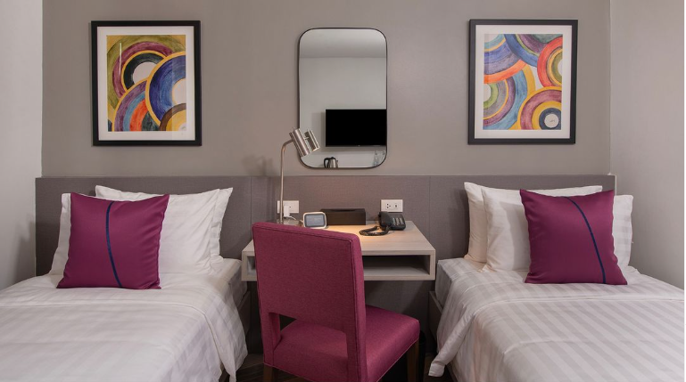 Hotel in Poblacion Makati with twin beds, colorful decor and convenient workstation