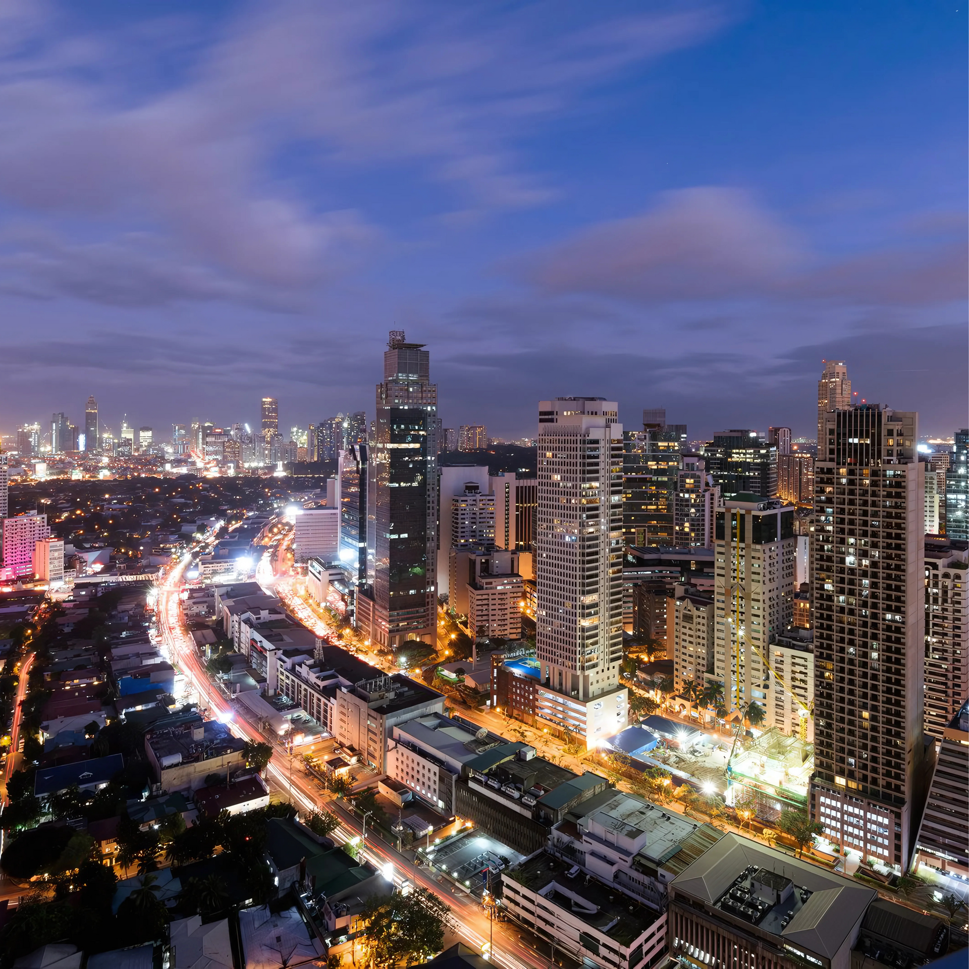 Night skyline view from Poblacion hotel room at The Belamy House