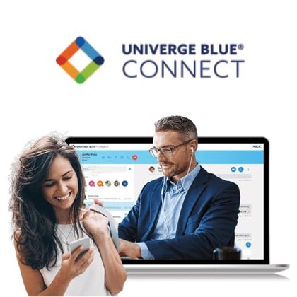 A man and a woman are looking at their phones in front of a laptop.
