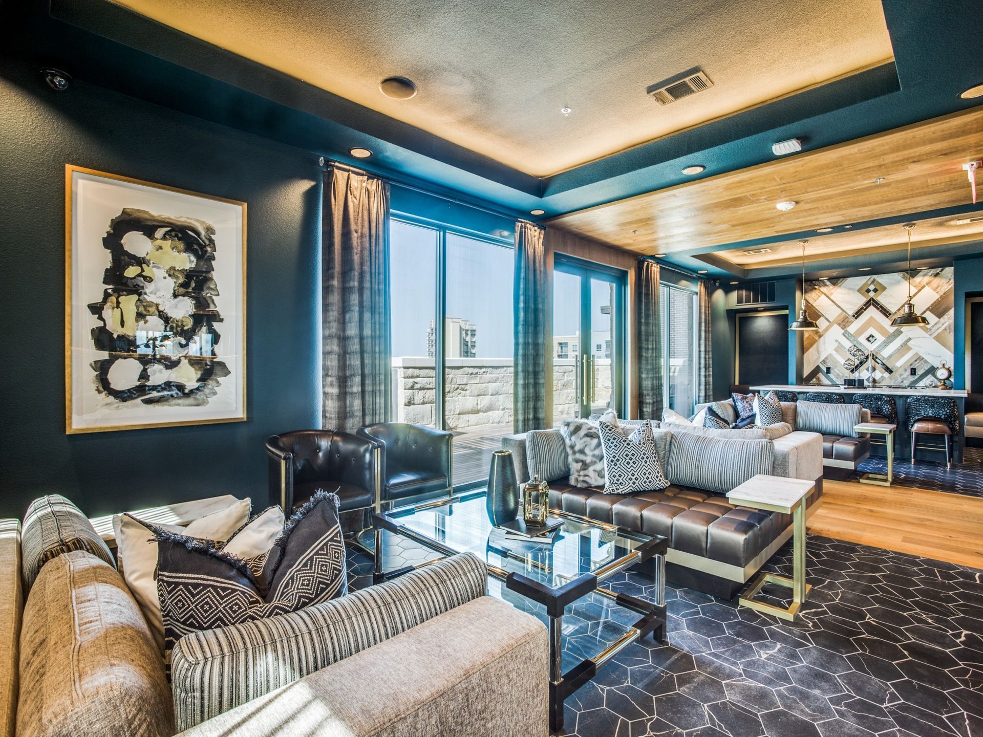 Spcious clubhouse with sofa and luxury finishes.