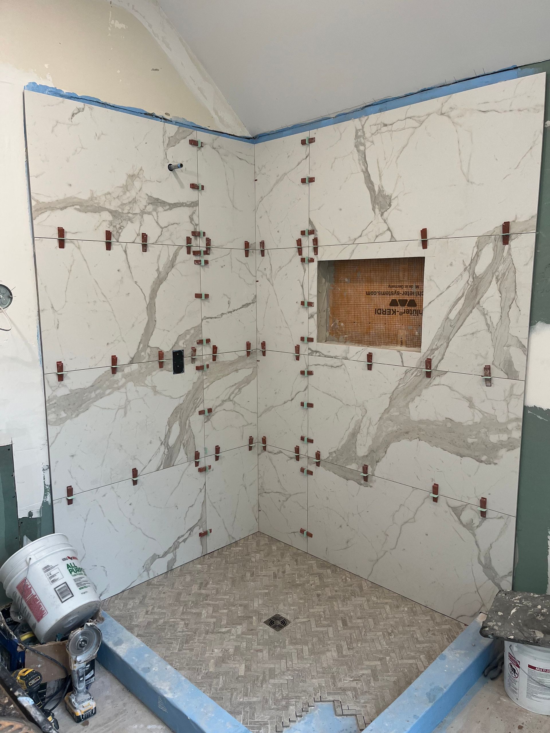 Marble tile bathroom renovation in progress Stamford CT by Executive Homes