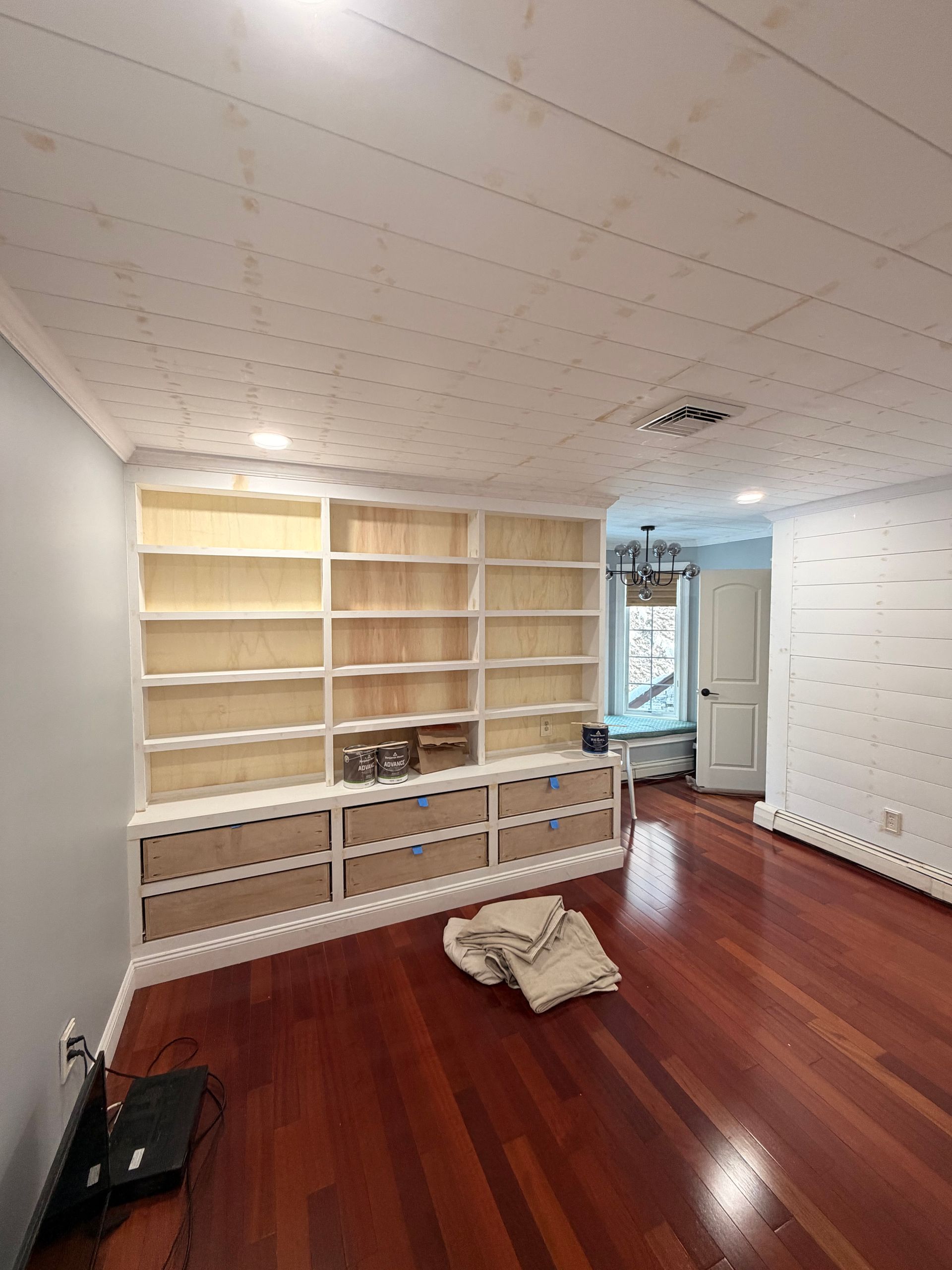 built in bookshelf and ceiling shiplap work Fairfield County CT by Executive Homes