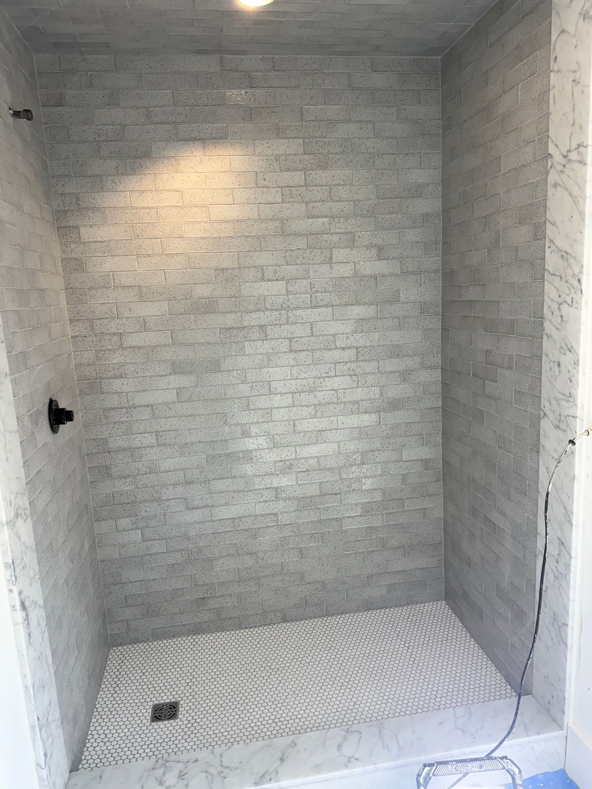 Tile installation in progress Fairfield County CT by Executive Homes