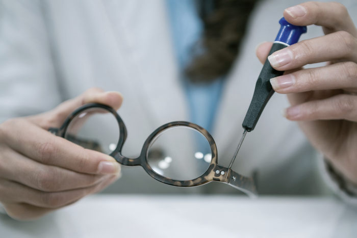 Photo-showing-technician-repairing-spectacles