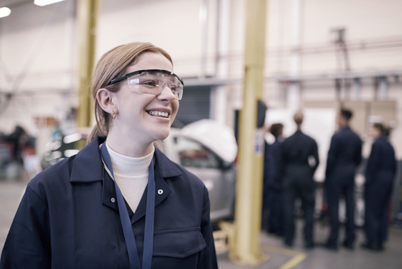 Woman-working-in-factory-wearing-safety-goggles 