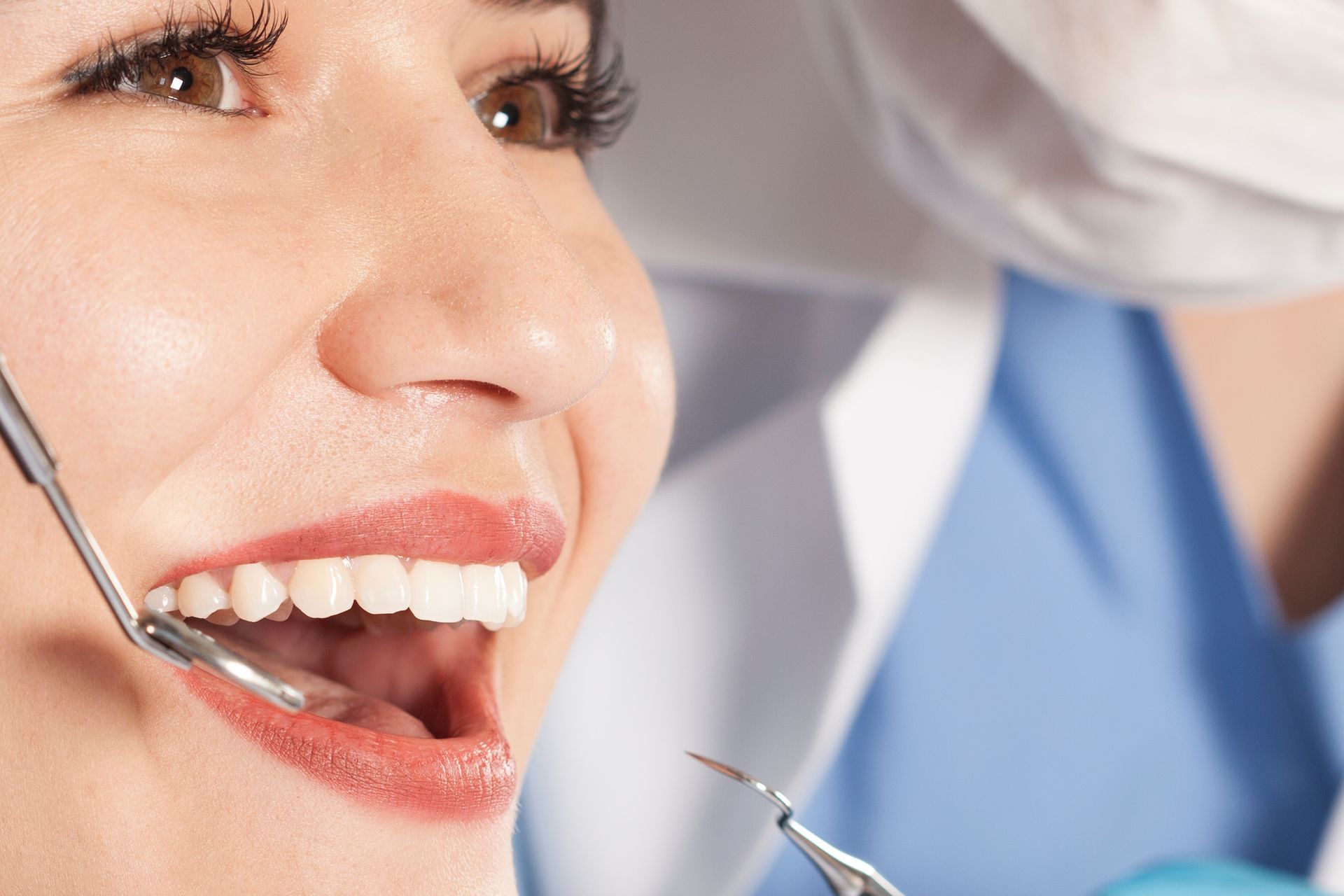 Cosmetic dentistry treatment for a patient receiving a dental exam.