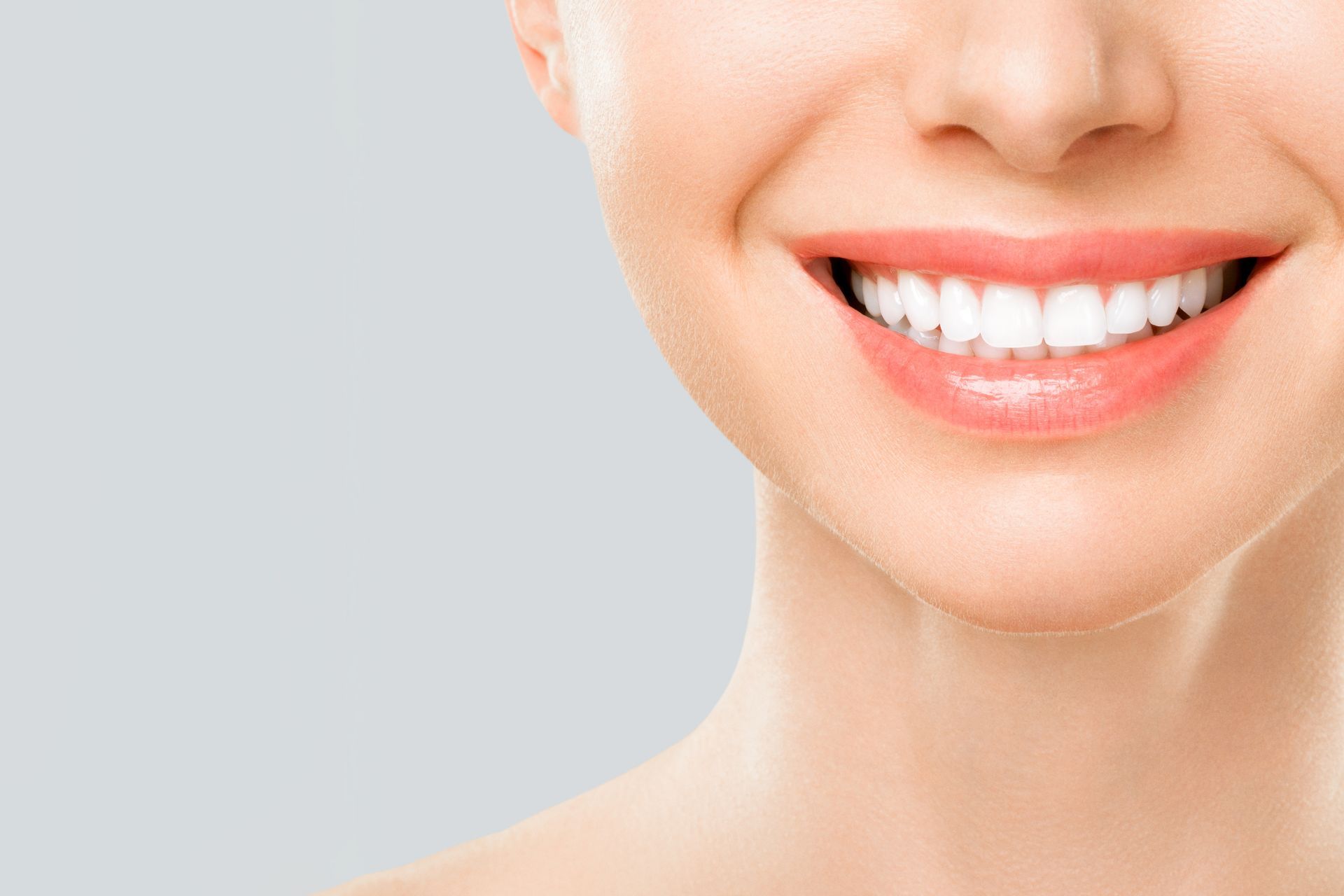 Close-up of a woman's bright, white smile after a dental makeover.