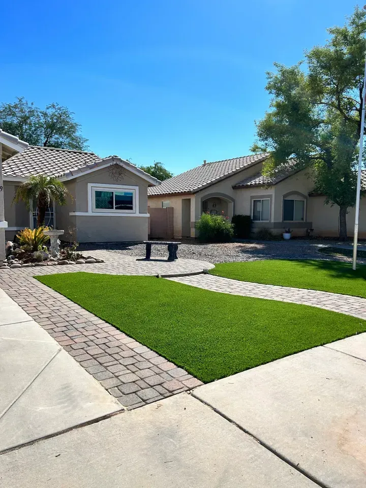 A house with a brick walkway leading to it