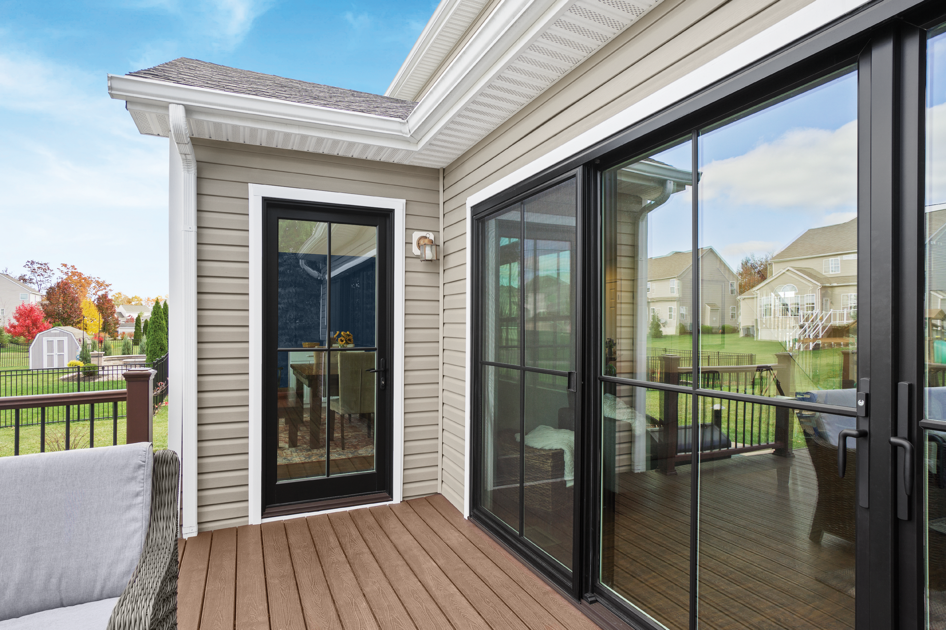 A patio with sliding glass doors and a couch.