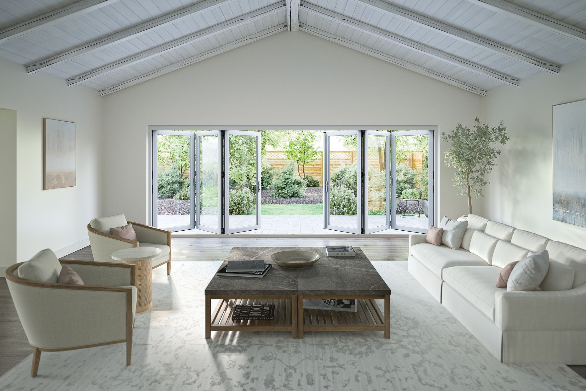 A living room with a couch , chairs , coffee table and lots of windows.