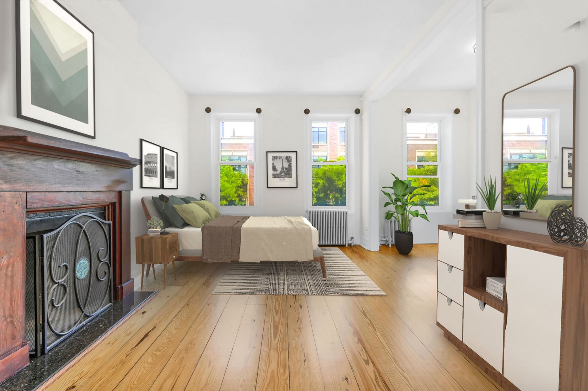 A bedroom with a bed , fireplace , dresser and mirror.