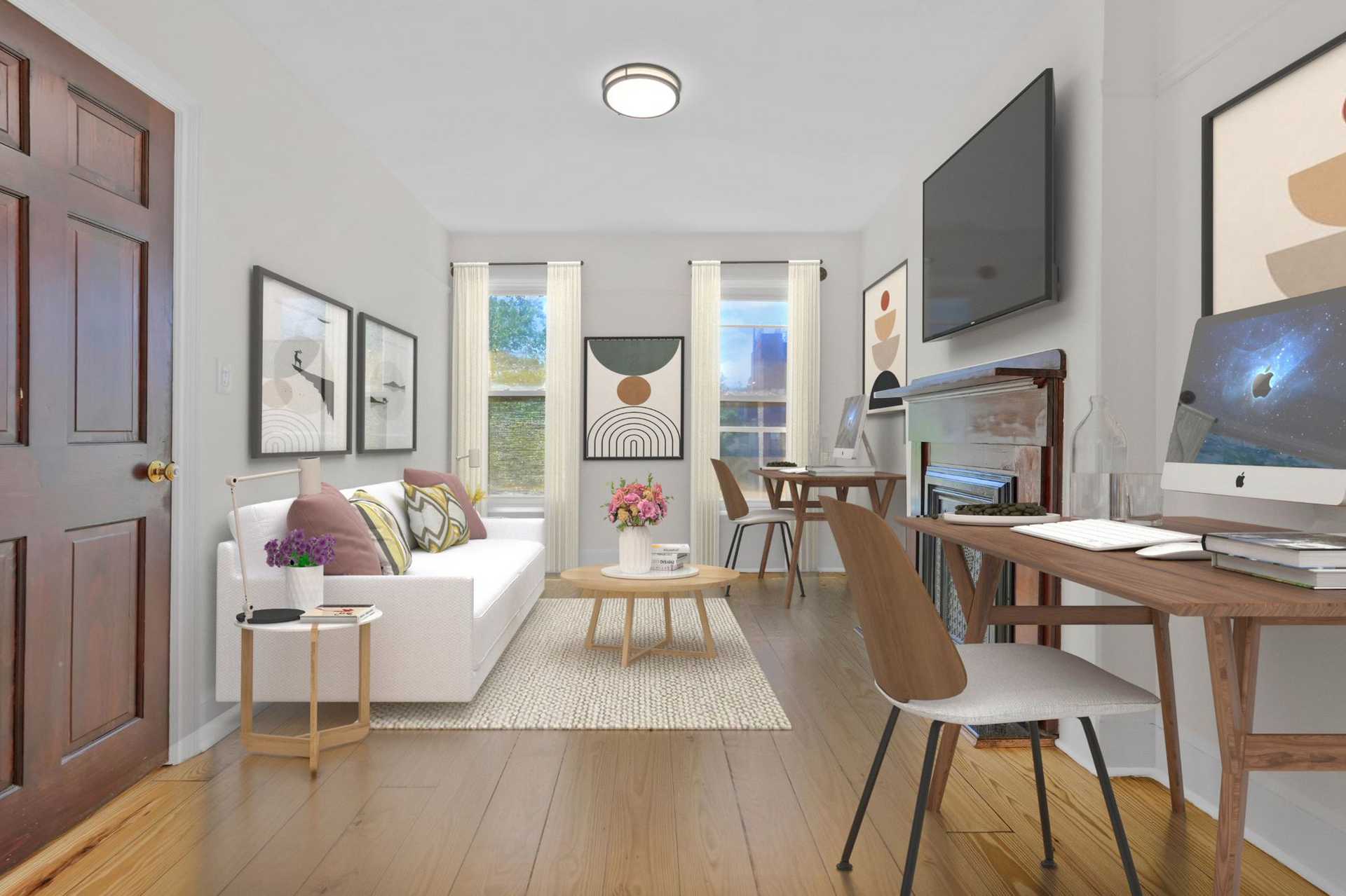 A living room with a couch , desk , chairs and television.