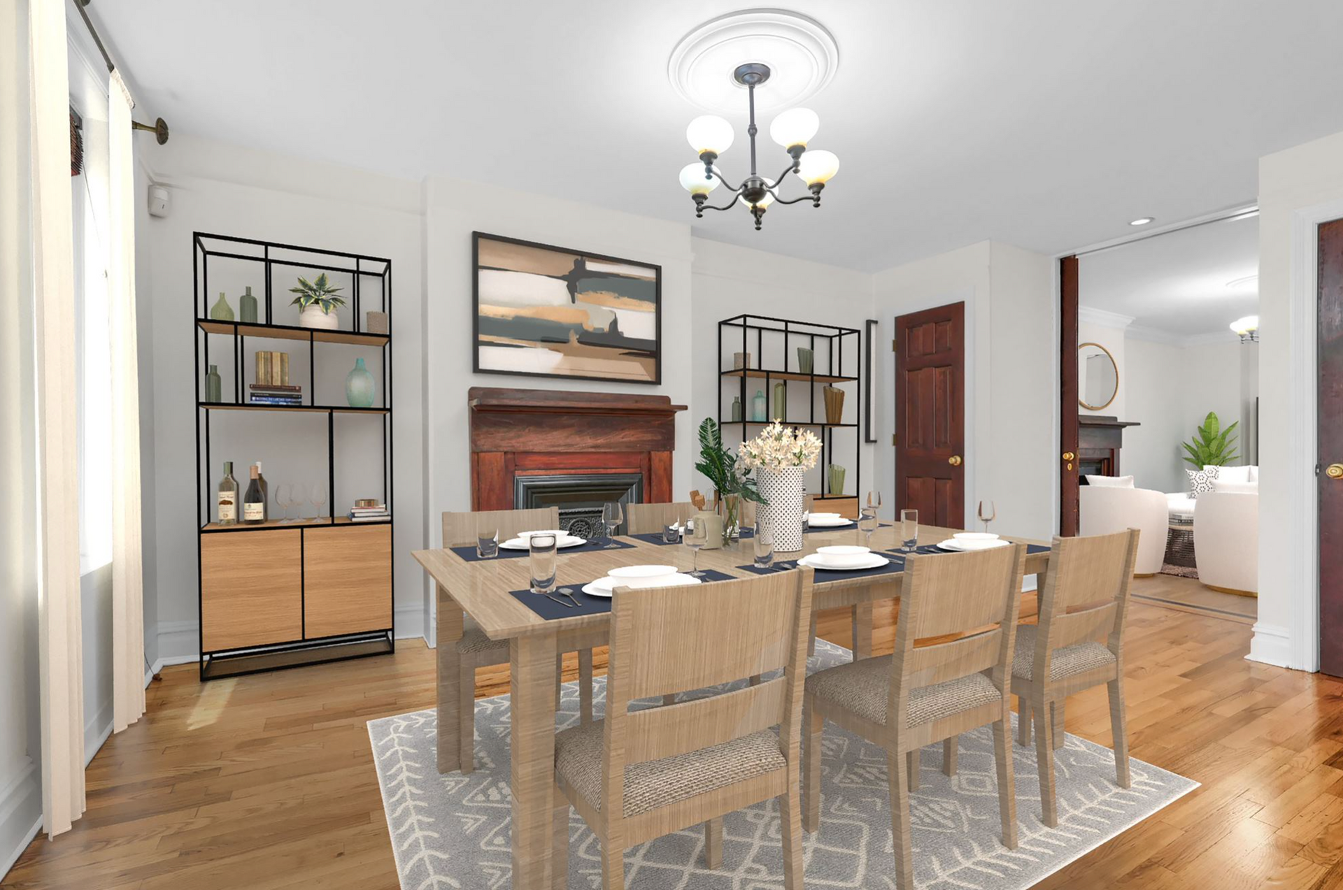 A dining room with a table and chairs and a fireplace.